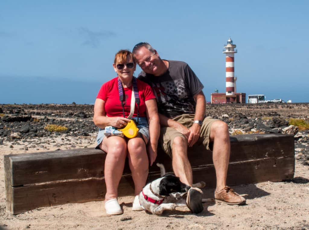 About Us 1 Sue, me and Oscar at the El Cotillo lighthouse